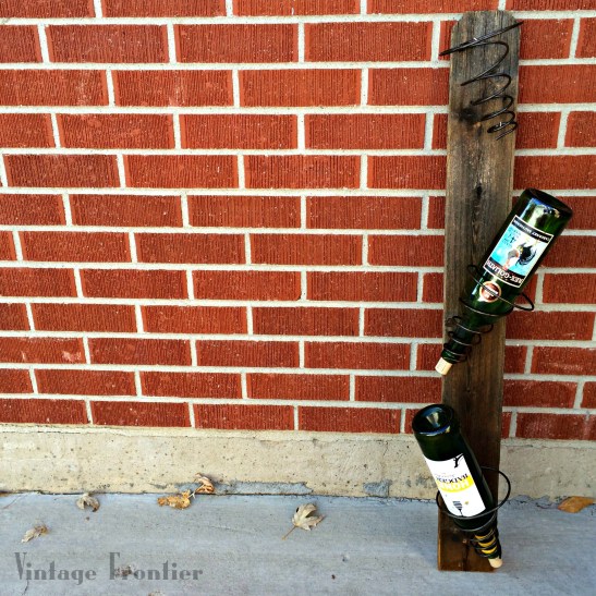 Create a rustic wine rack with nothing but old bed springs.